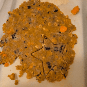 A star shaped cookie sitting on top of a plate.