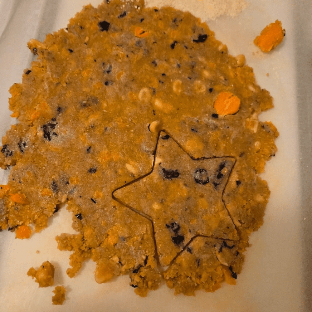 A star shaped cookie sitting on top of a plate.
