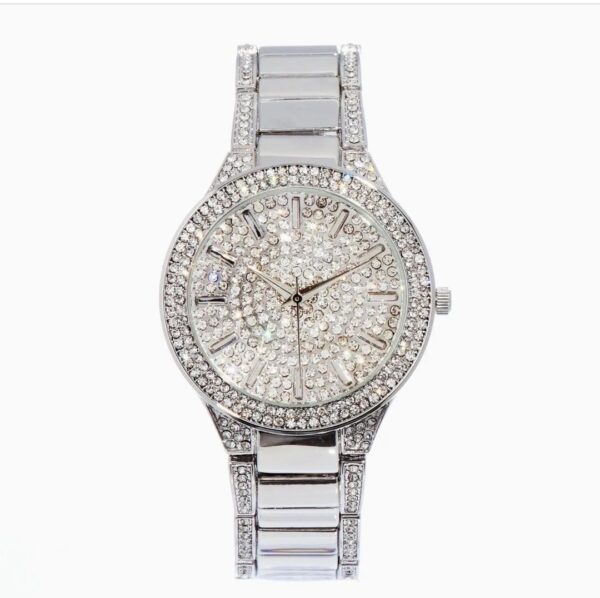 A silver watch with a diamond face on top of it.