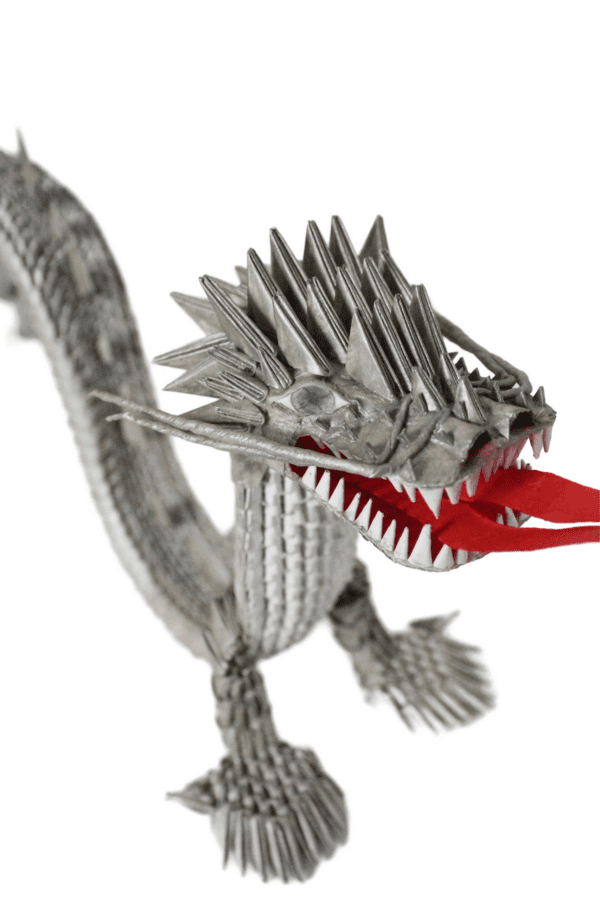 A dragon made out of paper and red lips.