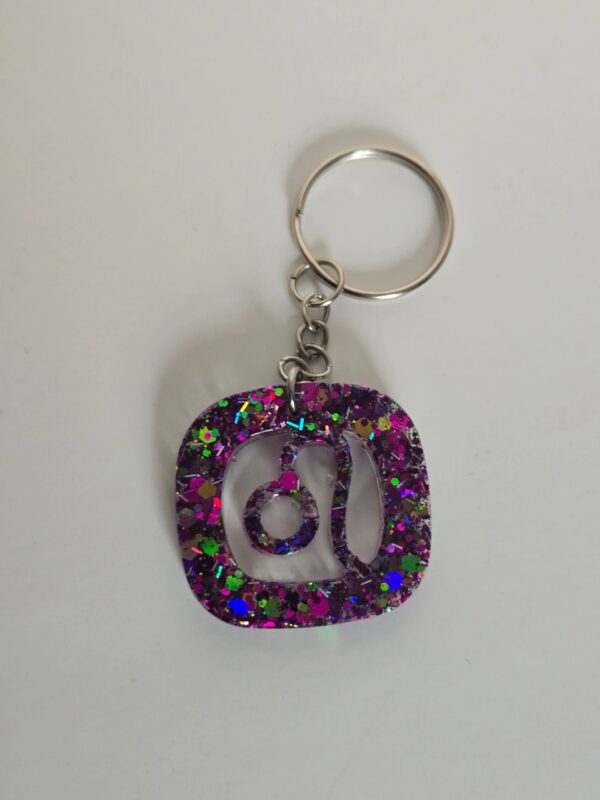 A key chain with the letter u in an open shape.