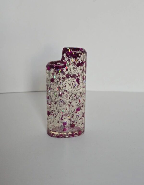 A small vase with purple and white speckles.