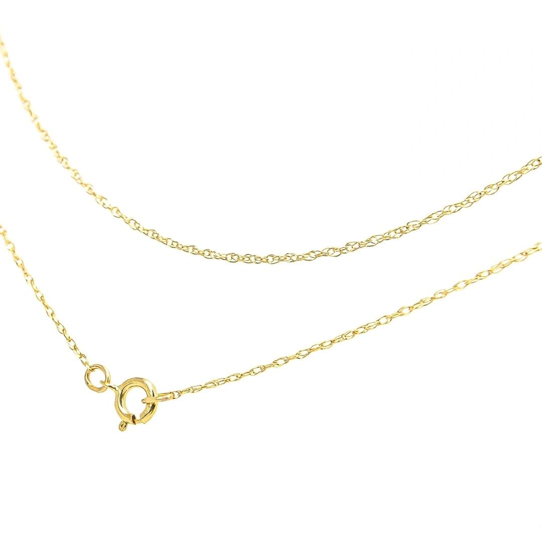 A gold chain with an open heart charm.