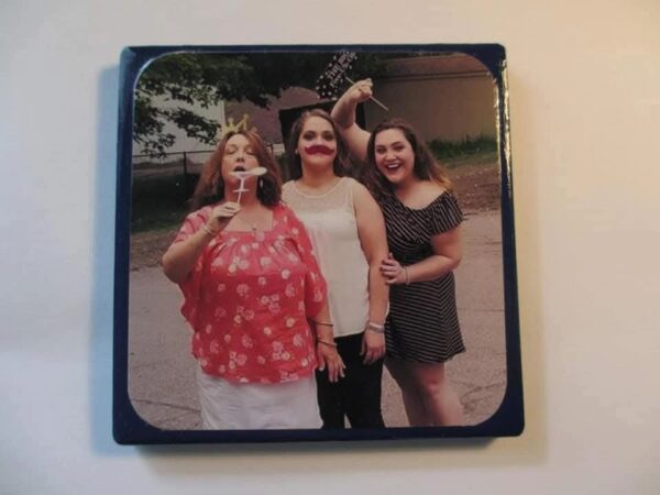 A picture of three women standing next to each other.