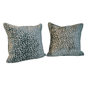 A pair of pillows with animal print on them.
