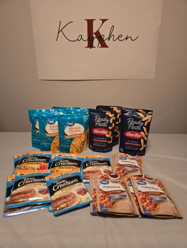 A table with several bags of food and two packages.