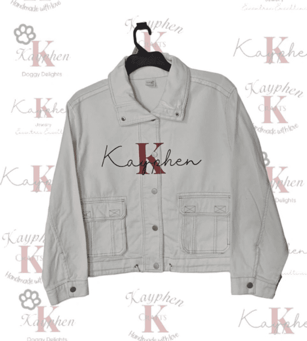 A white jacket with the letters k and kathen on it.