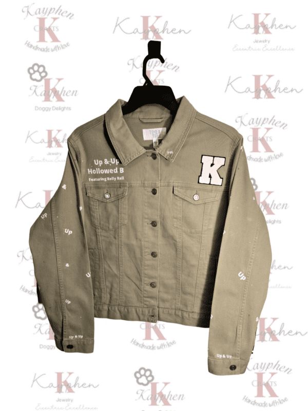 A khaki jacket with the letter k on it.