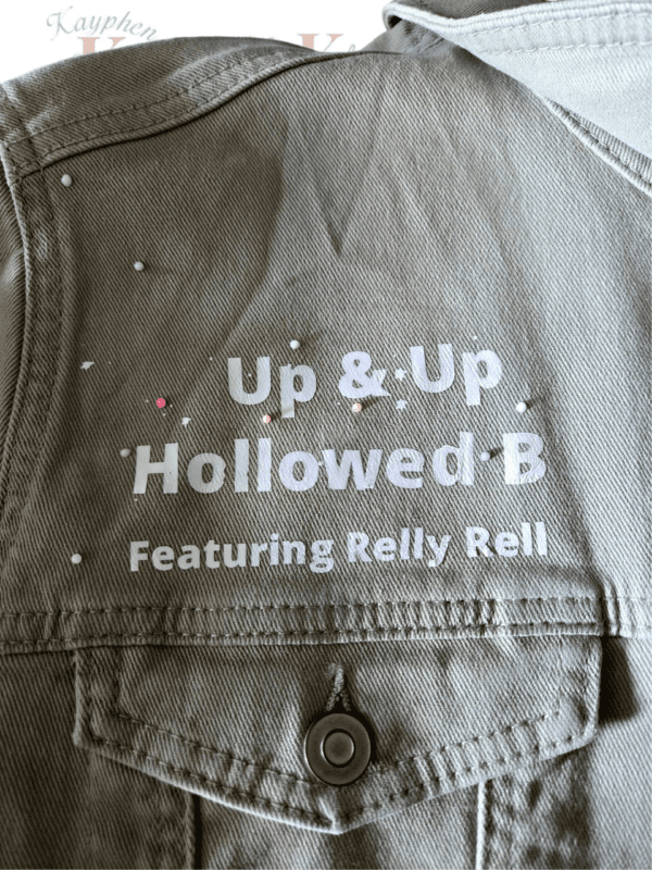 A close up of the back of a jacket with text