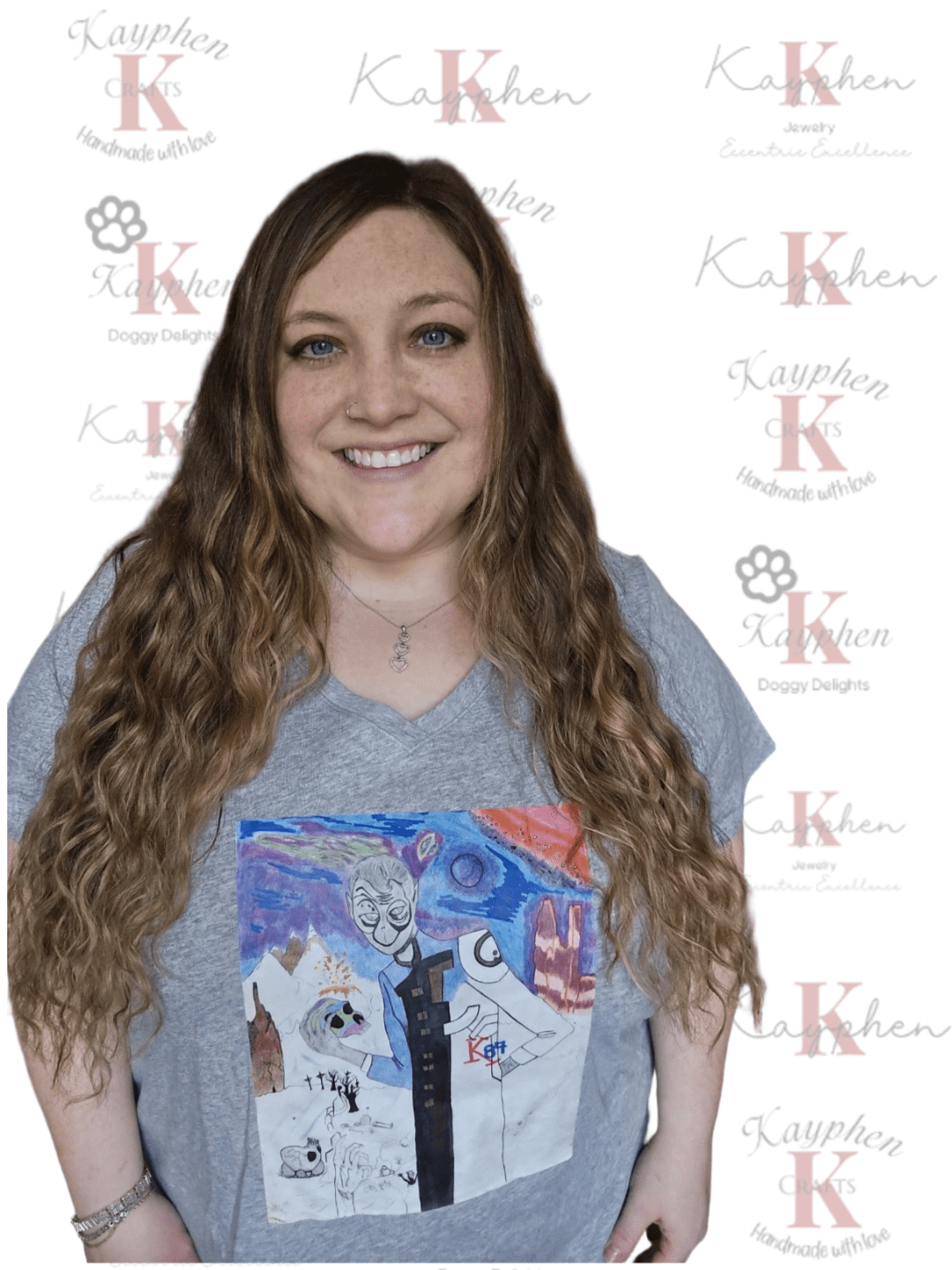 A woman with long brown hair wearing a t-shirt.