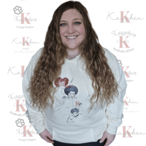 A woman with long hair and a white sweatshirt.