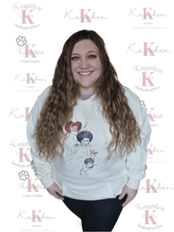 A woman with long hair and a white sweatshirt.