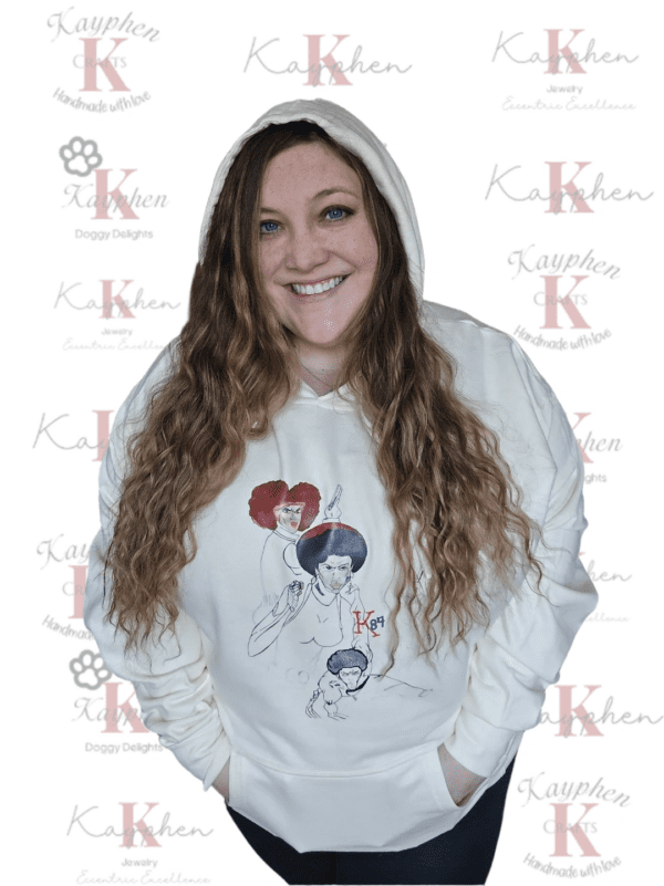 A woman wearing a white hoodie with three different pictures on it.