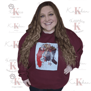 A woman standing in front of a maroon background.