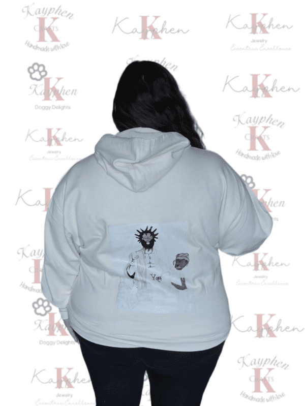 A woman wearing a white hoodie with an image of a person on it.