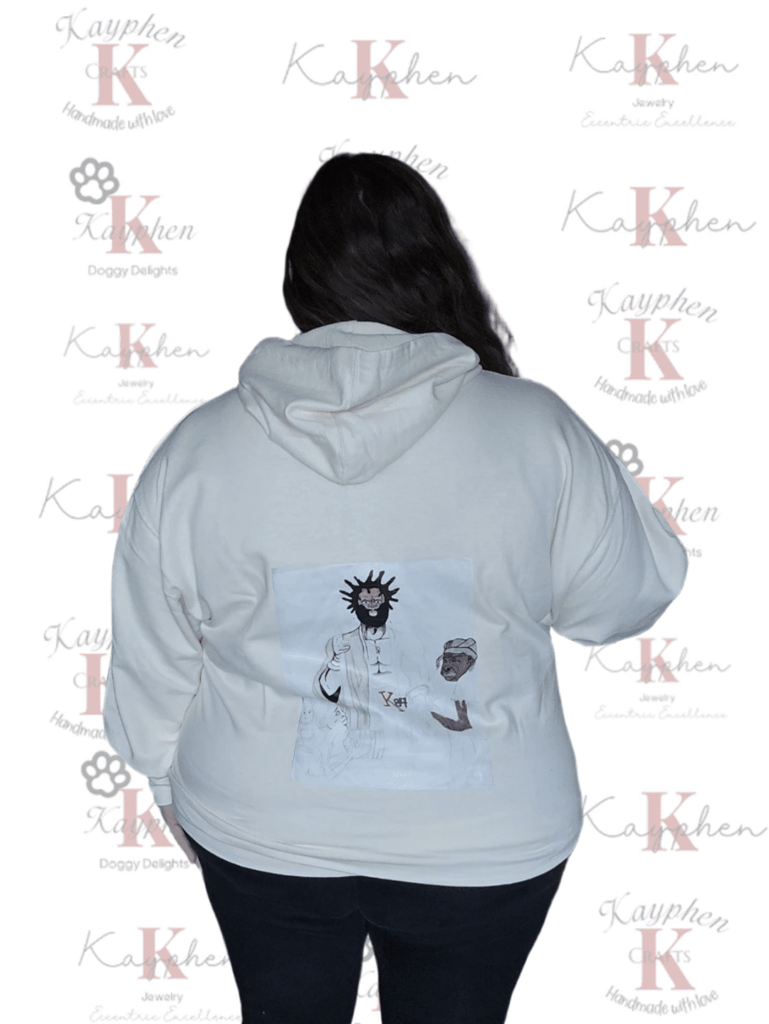 A woman wearing a white hoodie with an image of a person on it.