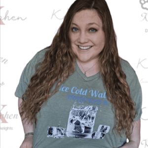 A woman with long hair wearing a t-shirt.