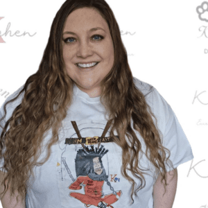 A woman with long hair wearing a t-shirt.