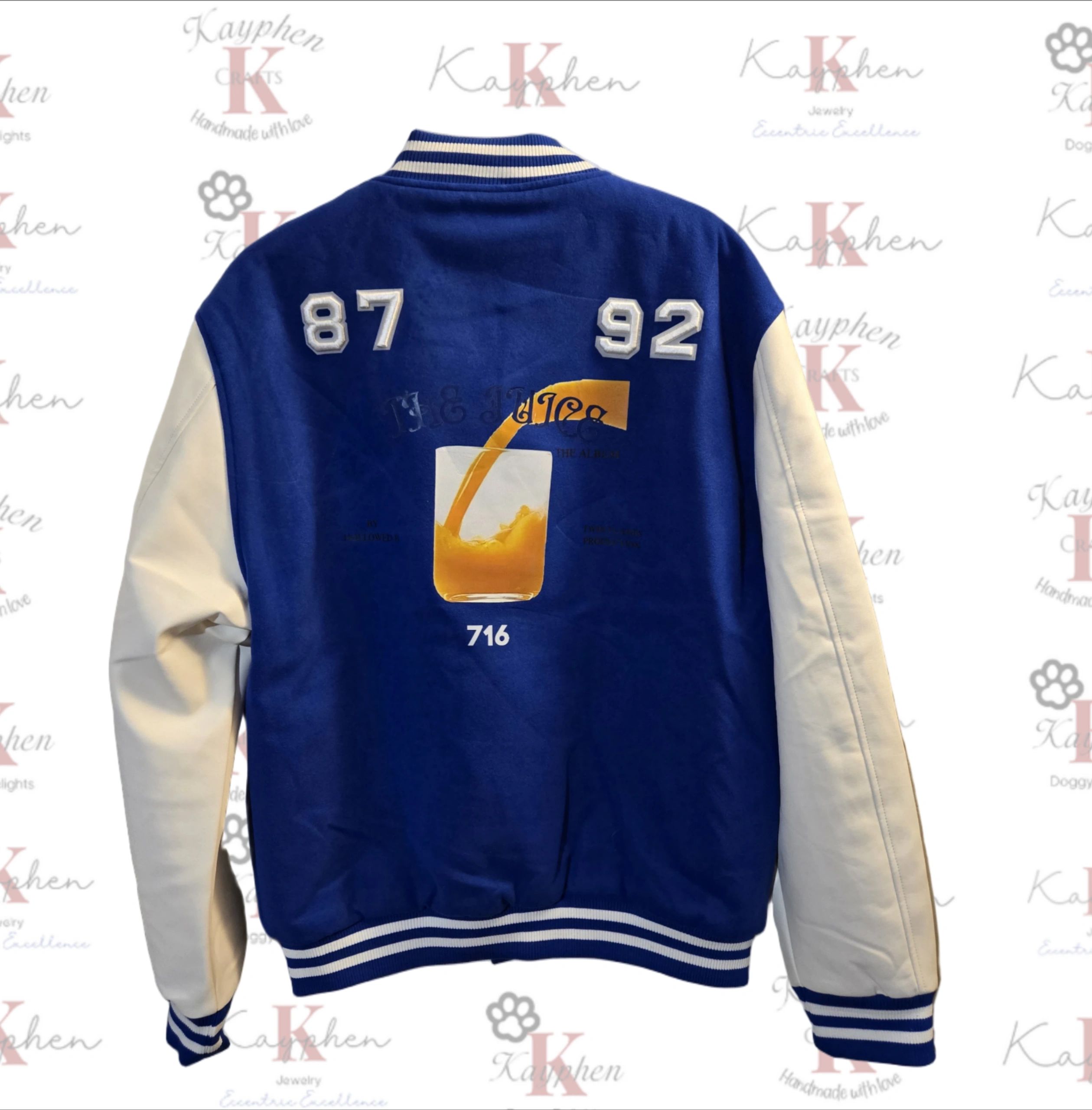 1000011052 A blue and white letterman jacket with the number 8 7 9 2 on it.