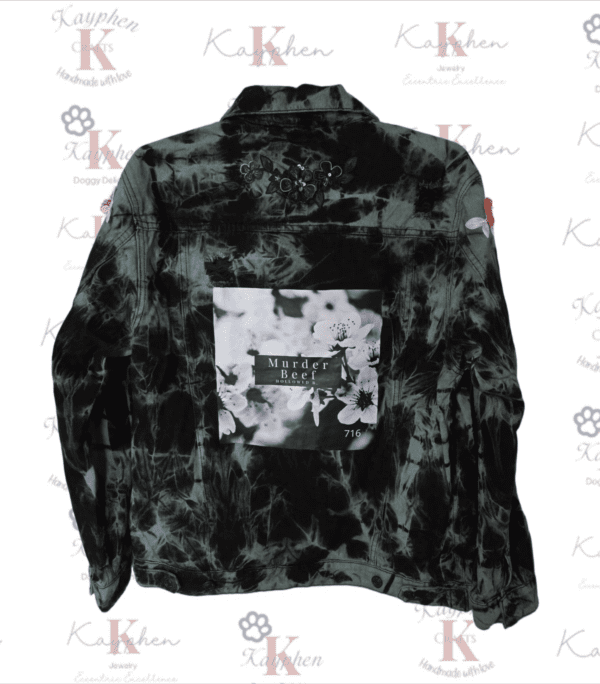 A black and white tie dye jacket with the words " western " on it.