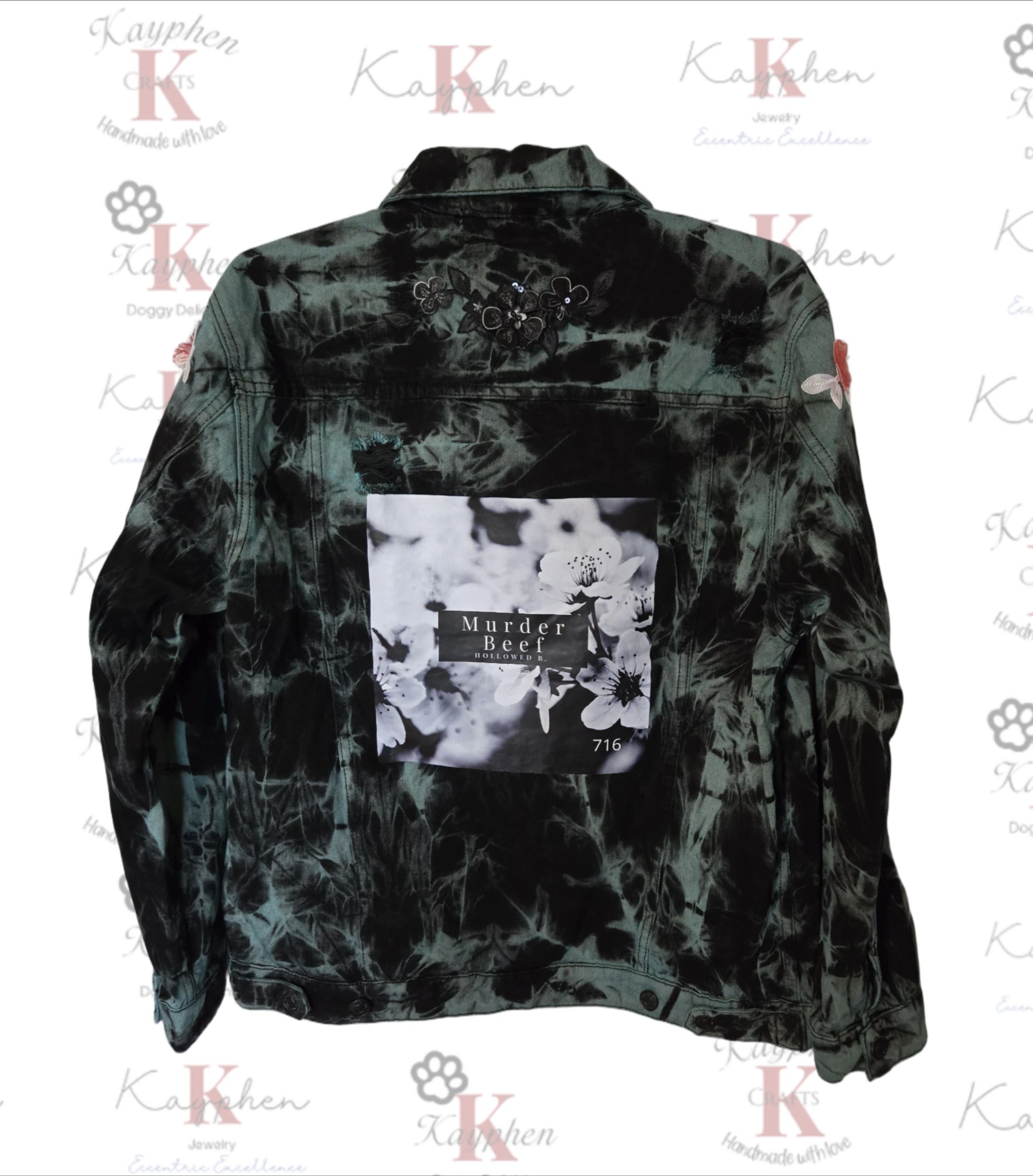 1000011056 A black and white tie dye jacket with the words " western " on it.