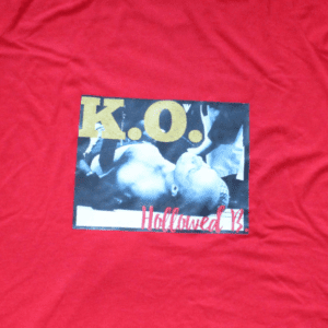 A red shirt with a picture of two birds.