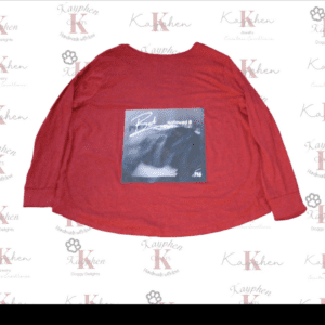 A red long sleeve shirt with an image of a bear.