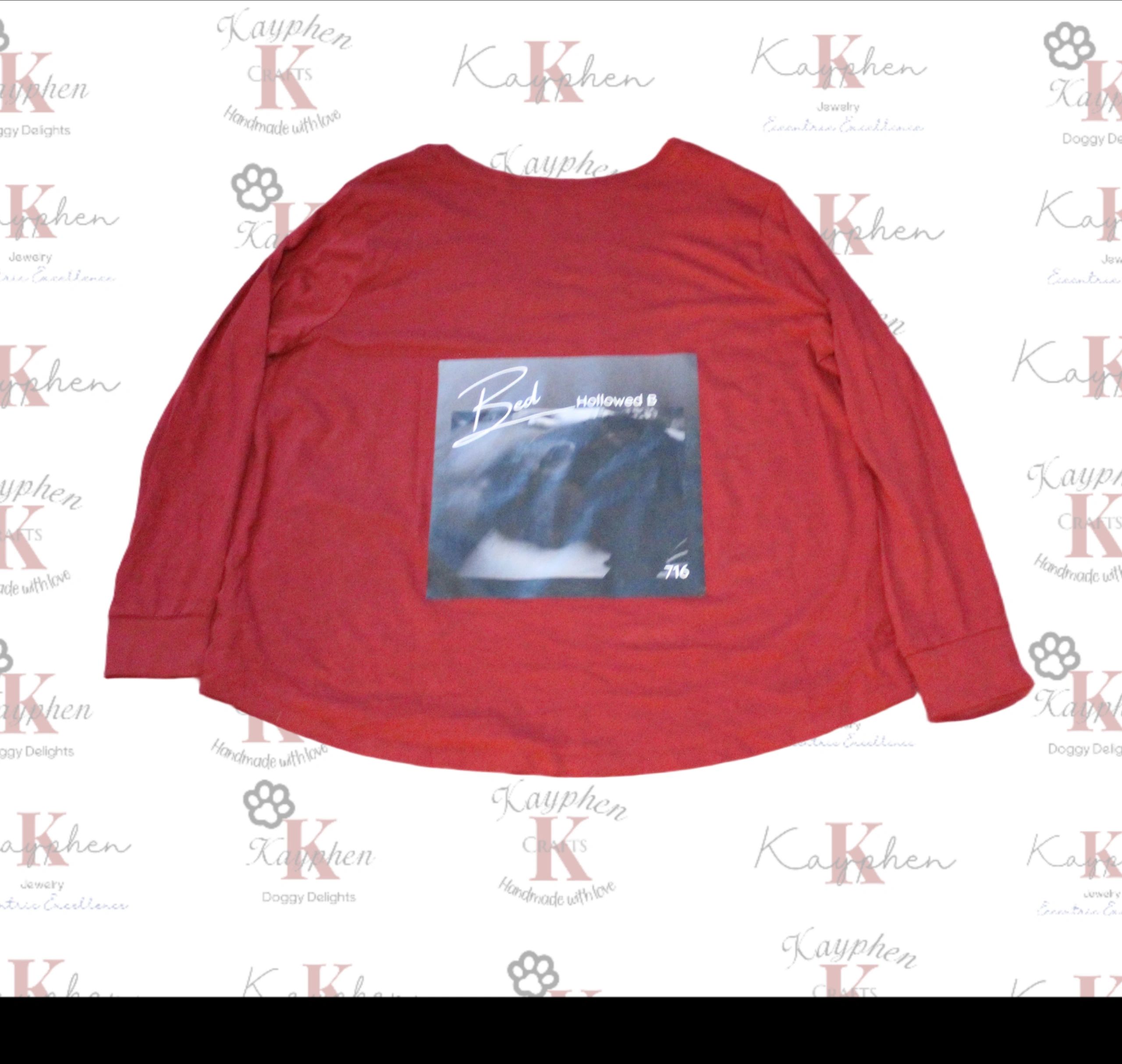1000011059 A red long sleeve shirt with an image of a bear.