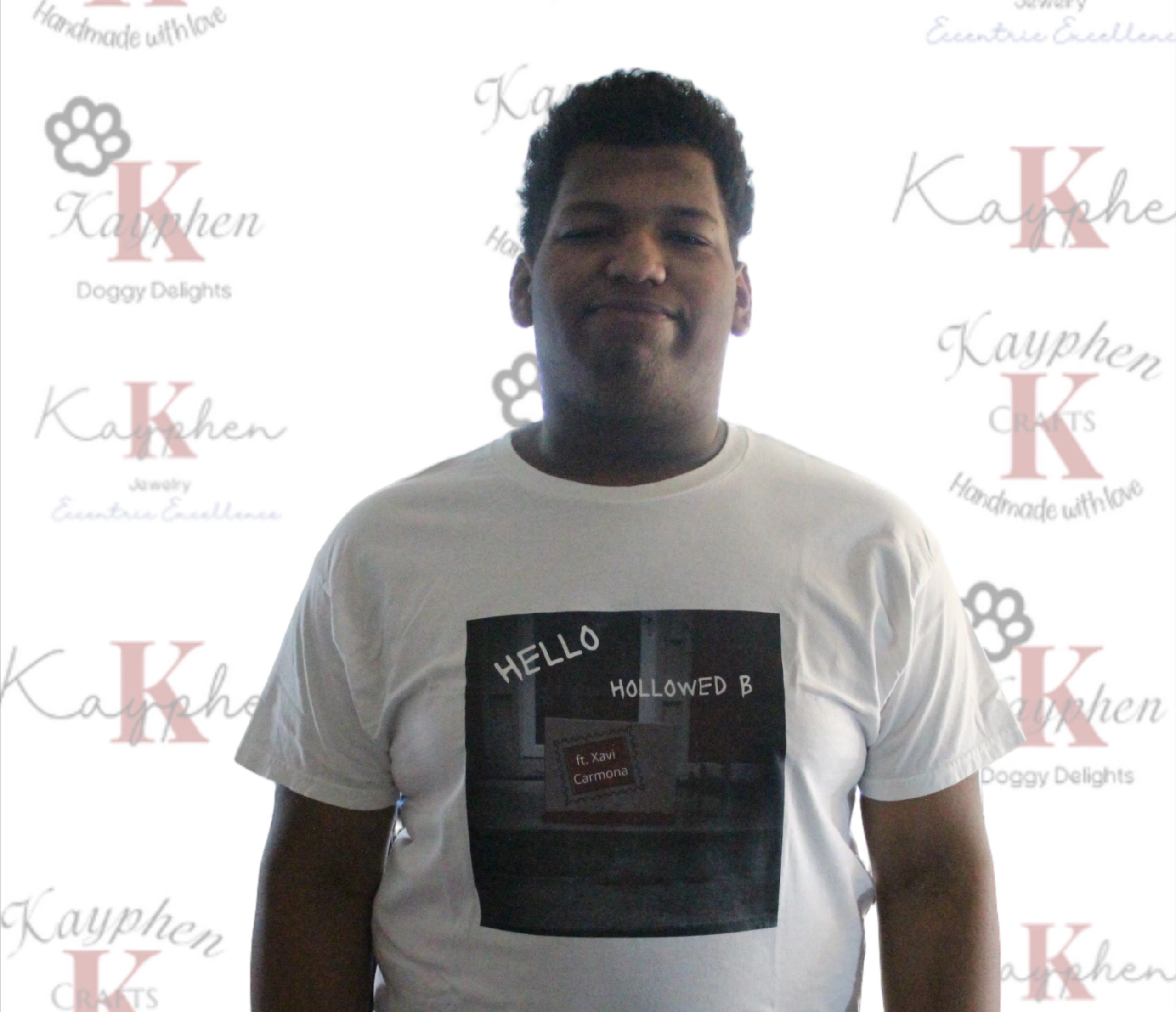 17419047005842 A man wearing a white shirt with the words " hello " on it.