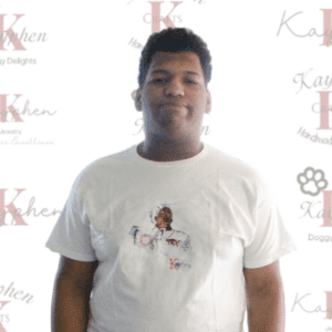 A man wearing a white t-shirt with an image of a dog.