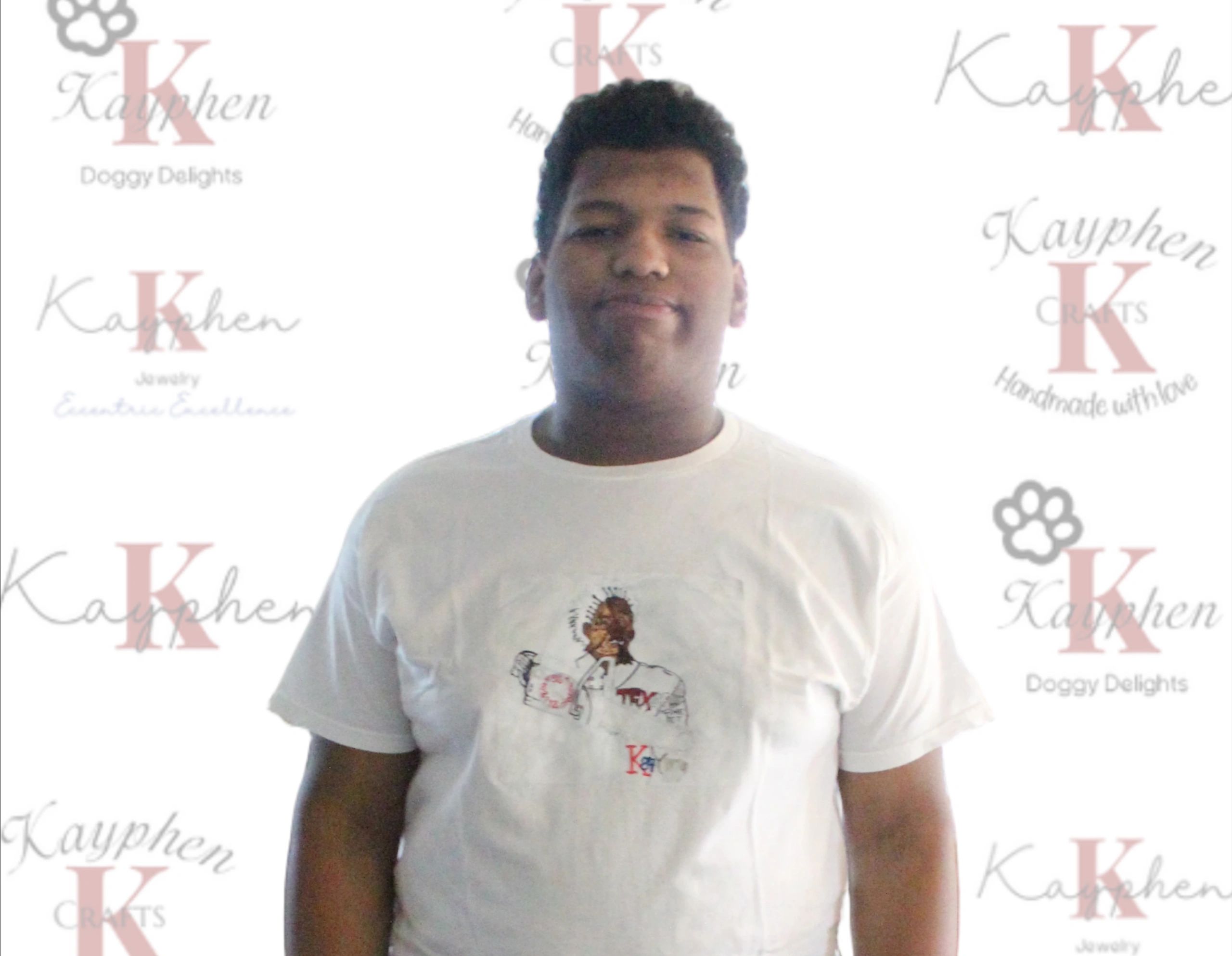 A man wearing a white t-shirt with an image of a dog.