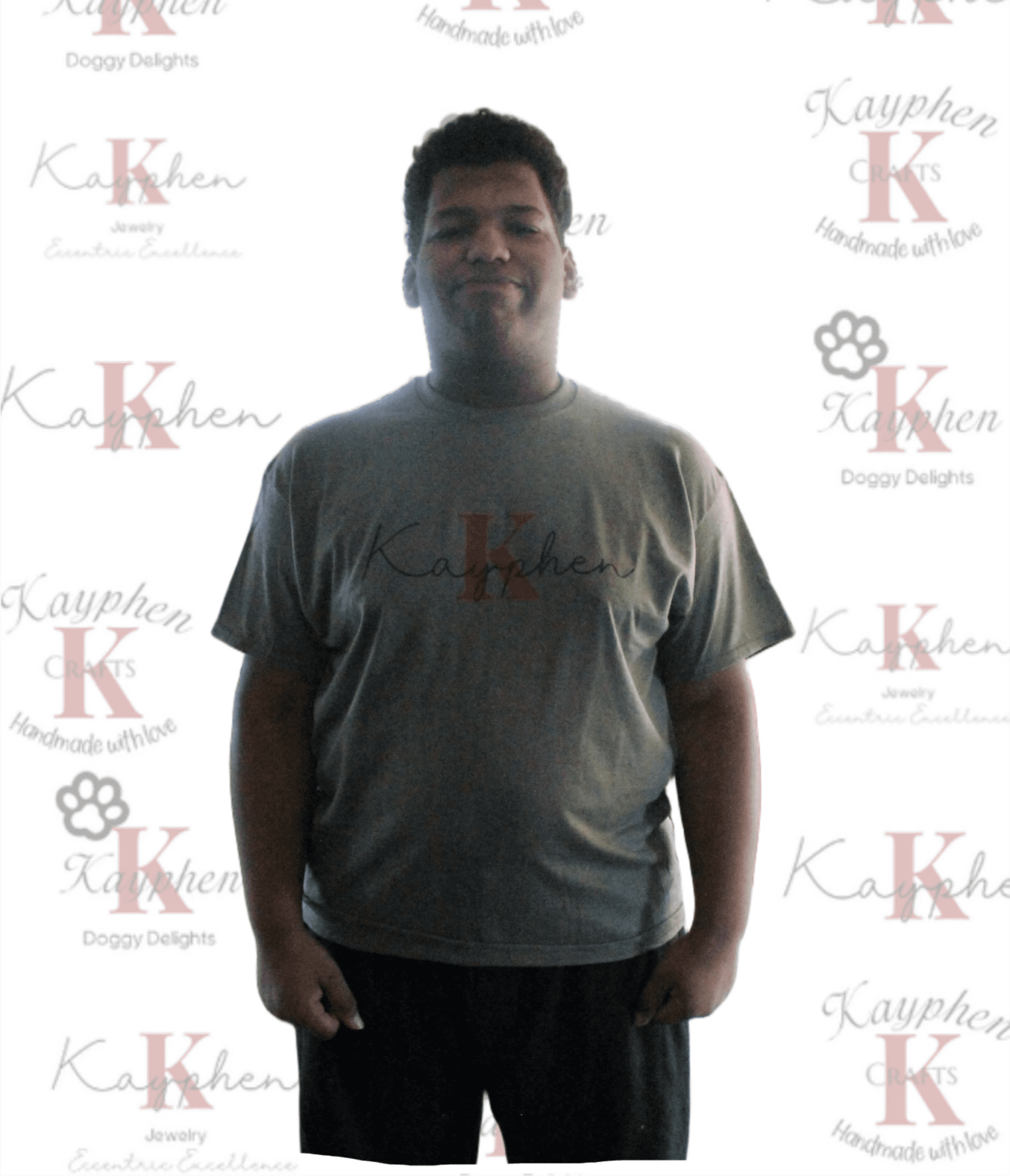 A man standing in front of a wall with the word " k " on it.