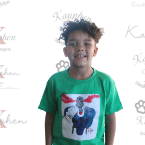 A young boy wearing a green shirt with an elephant on it.