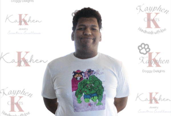 A man wearing a t-shirt with hulk on it.