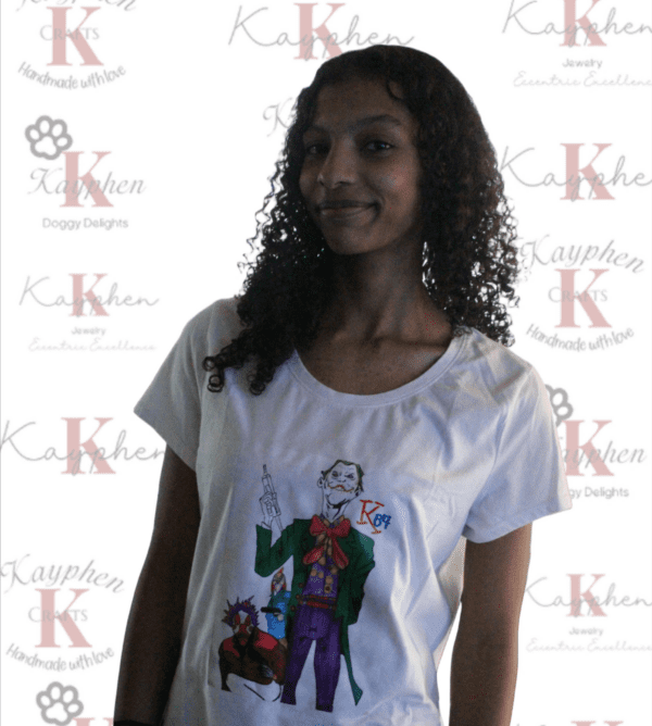 A woman standing in front of a white wall.