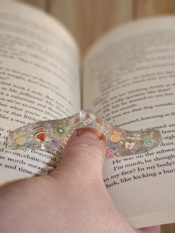 A person is holding an object in their hand.