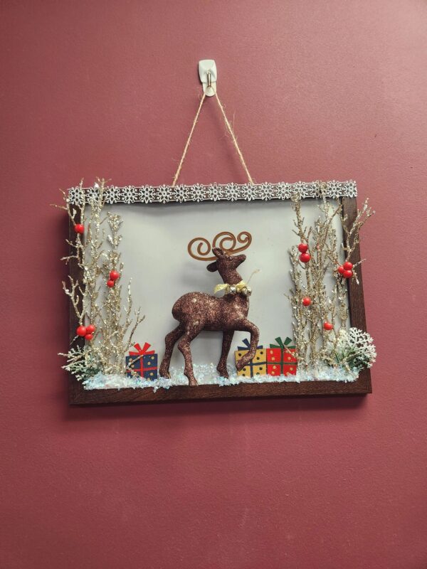 A picture frame with a deer on it