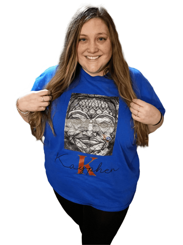 A woman holding onto the front of her t-shirt