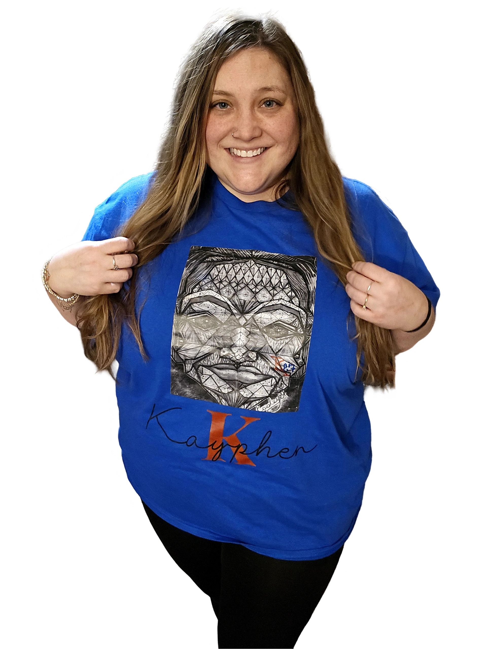 A woman holding onto the front of her t-shirt