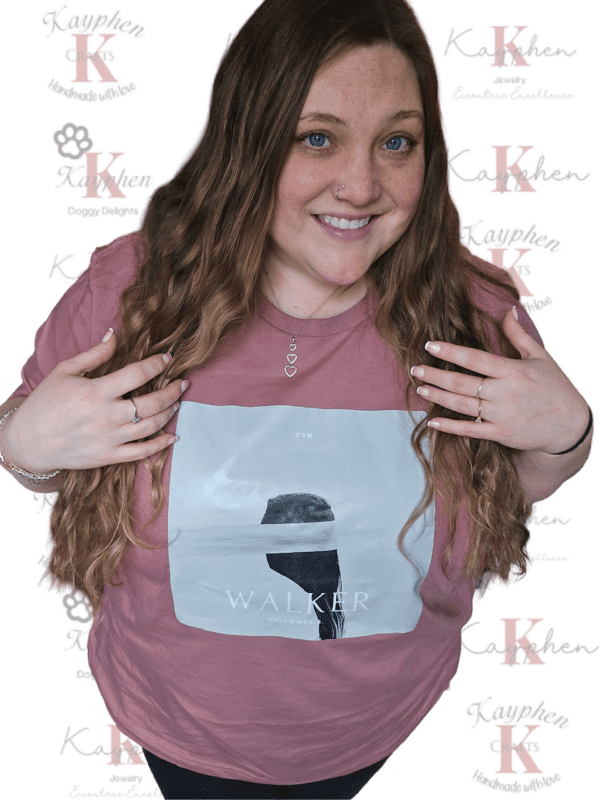 A woman with long hair and wearing a t-shirt.
