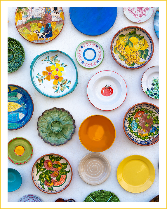 Group 27 A bunch of plates that are on the wall