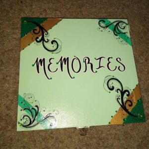 A green box with the word " memories " written on it.