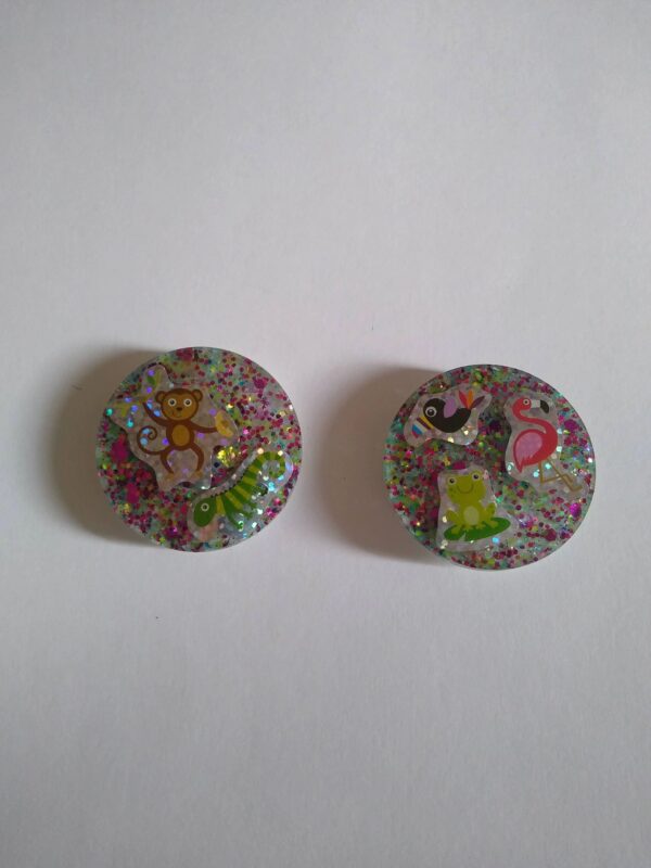 Two buttons with different designs on them.