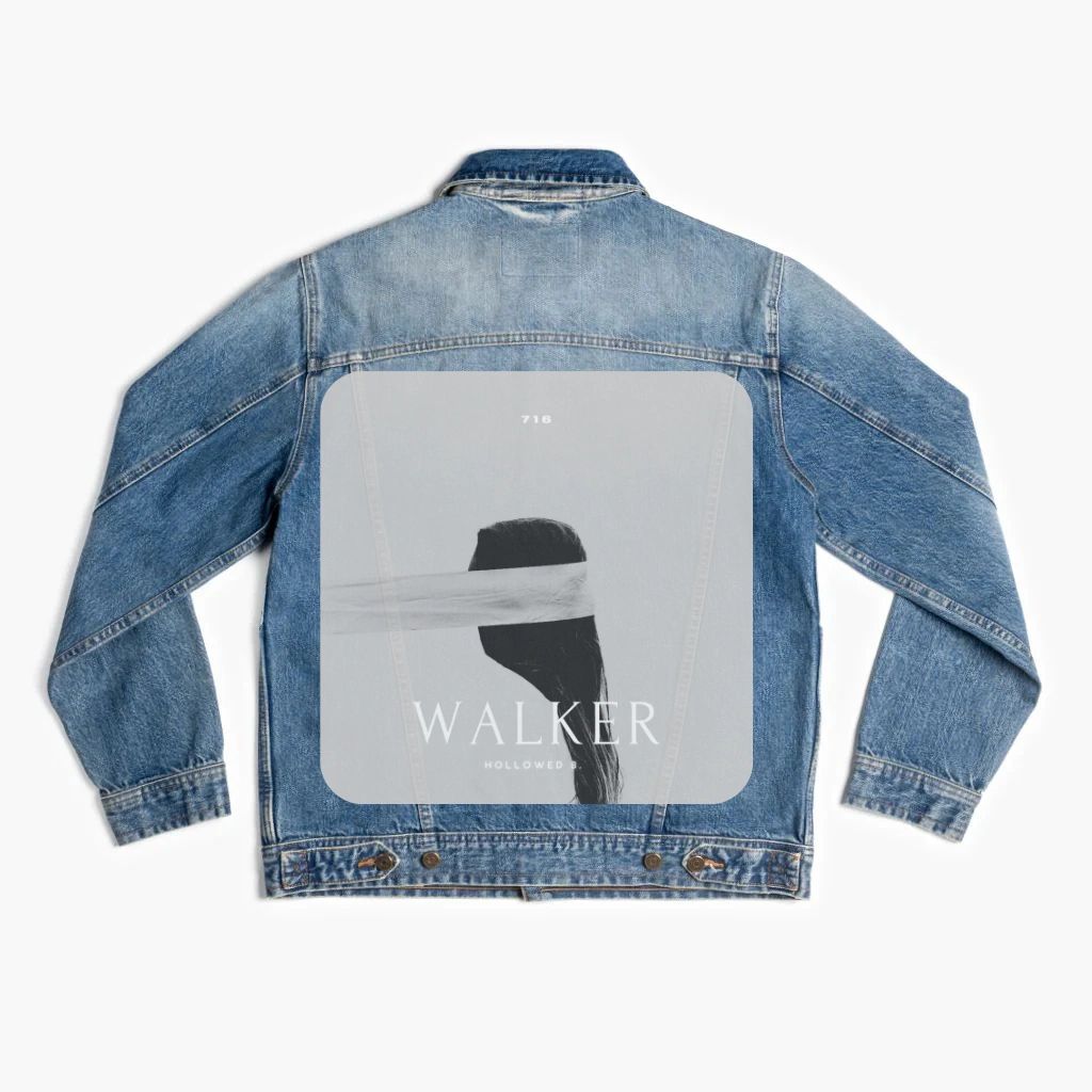 A denim jacket with a picture of a person wearing a blindfold.
