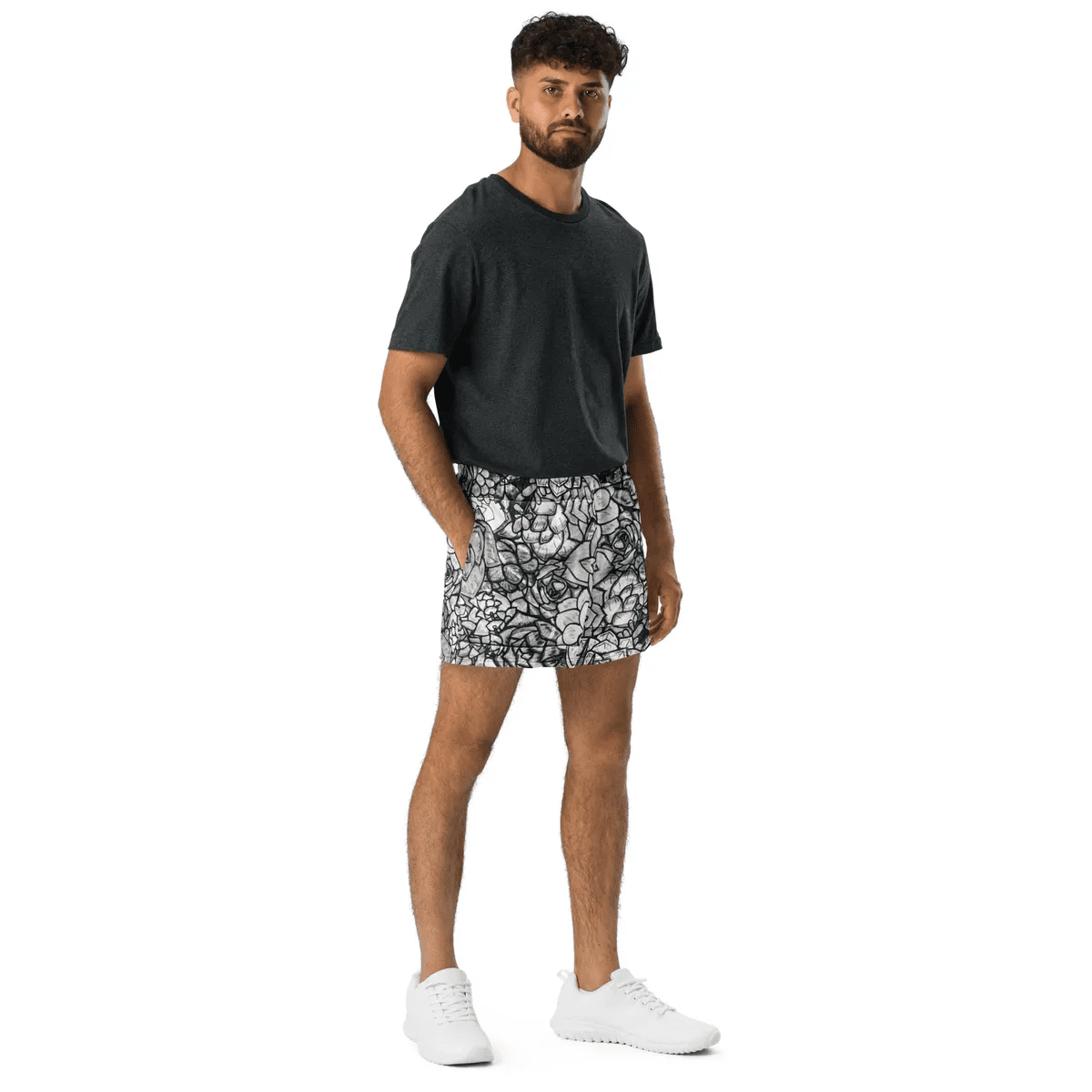 A man in black shirt and white shorts.