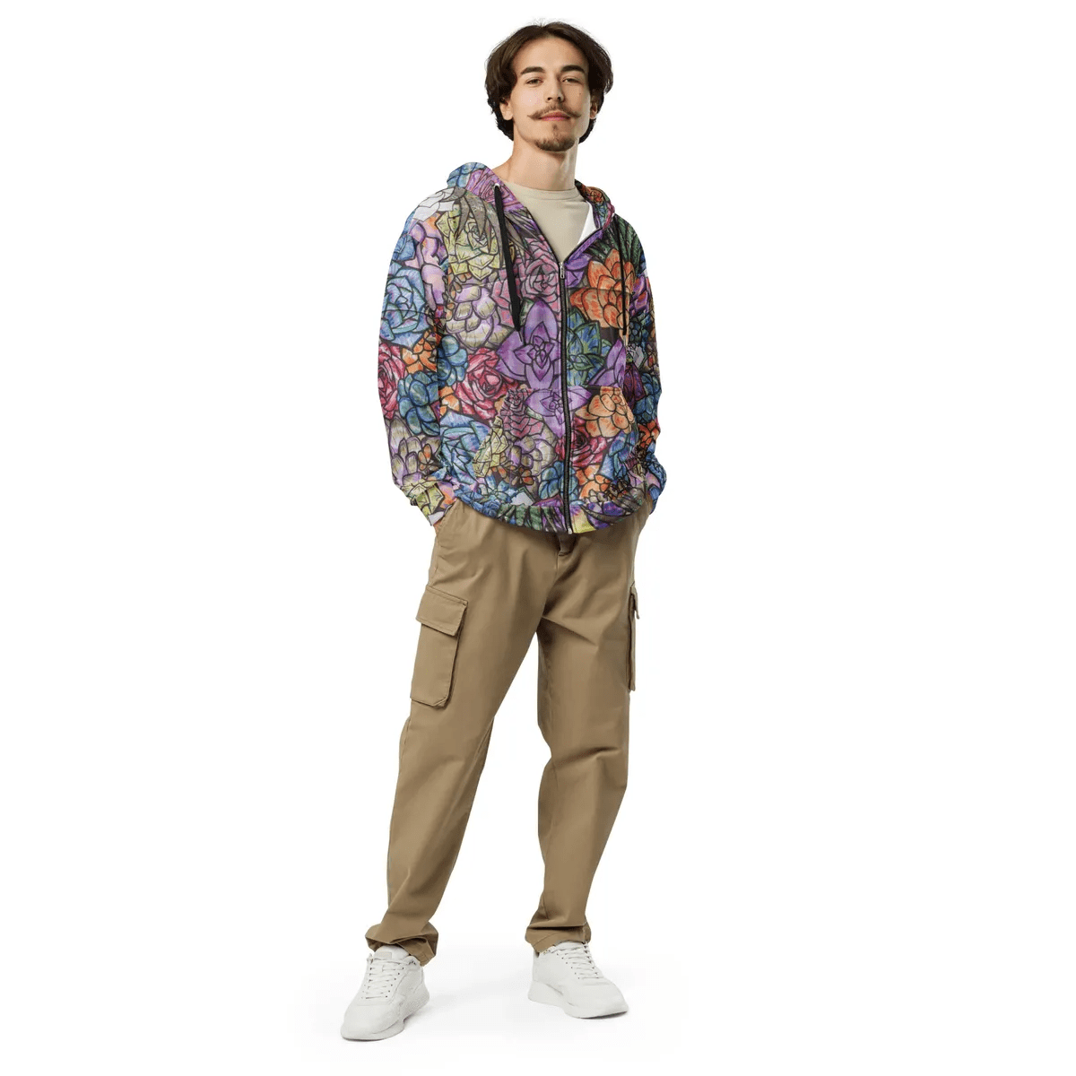 A man standing in front of the camera wearing a jacket.