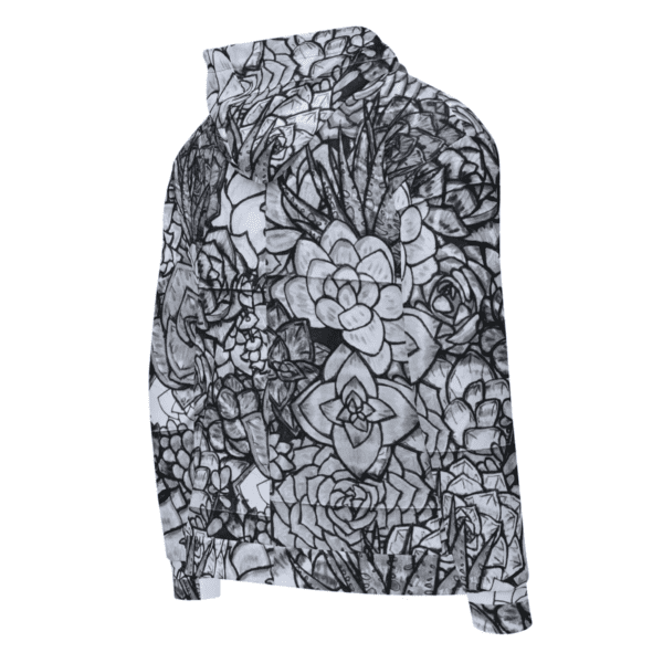 A black and white floral print on the back of a jacket.