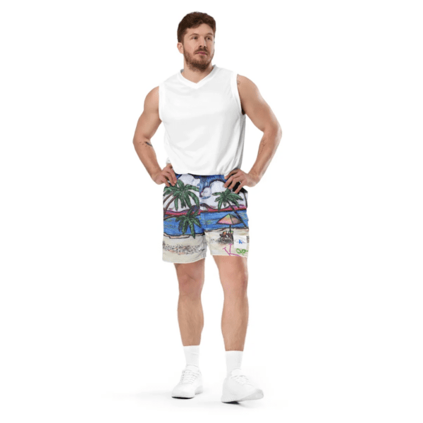 A man standing in front of the camera wearing shorts.